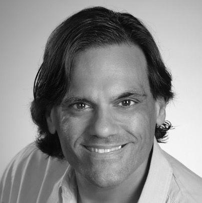https://flaia-cms-assets.s3.amazonaws.com/Aman_Verjee_B_and_W_headshot_4066b8d33e.jpeg
